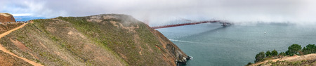 SAN FRANCISCO - AUGUST 5, 2017: Tourists enjoy Golden Gate Bridge view on a beautiful afternoon. The city attracts 25 million people annually.のeditorial素材