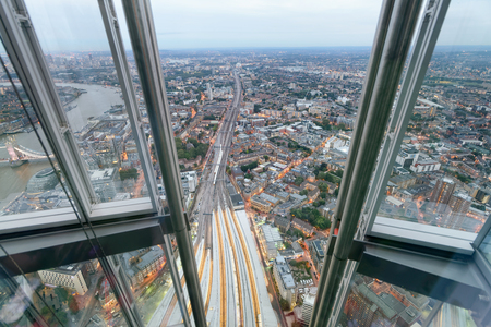 Aerial view of London Tower Bridge and skyline at night, London.の写真素材
