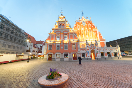 RIGA, LATVIA - JULY 7, 2017: City sunset colors in Town Hall Square. Riga attracts 3 million tourists annually.のeditorial素材