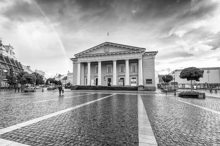 VILNIUS, LITHUANIA - JULY 9, 2017: City sunset colors in Town Hall Square. Vilnius attracts 3 million tourists annually.のeditorial素材