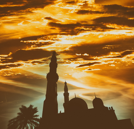 Mosque silhouette agains the shining sun.の写真素材