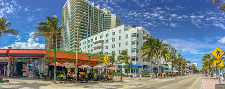 FORT LAUDERDALE, FL - FEBRUARY 29, 2016: Tourists and locals enjoy the promenade along the sea. Fort Lauderdale is a famous tourist attraction in Florida.のeditorial素材