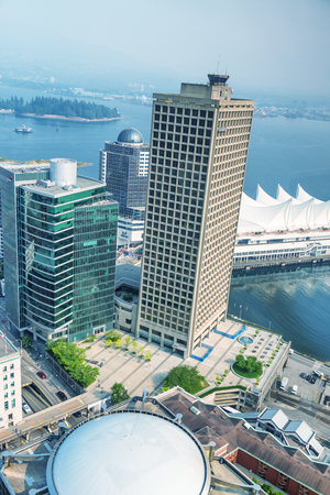 VANCOUVER, CANADA - AUGUST 8, 2017: Aerial view of Canada Place on a sunny day. Vancouver attracts 10 million people annually.のeditorial素材