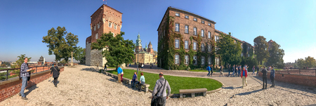 KRAKOW, POLAND - OCTOBER 2, 2017: Tourists visit the citadel area, panoramic view. The city attracts 3 million visitors annually.のeditorial素材
