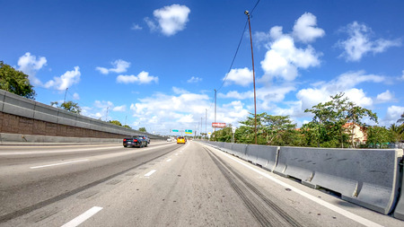 MIAMI, FL - APRIL 2018: Traffic along I-95 interstate. THis is a major road that crosses US.のeditorial素材