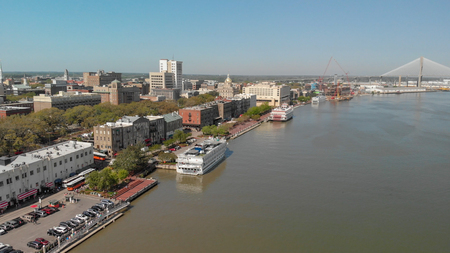 SAVANNAH, GA - APRIL 3, 2018: Aerial city skyline from the river. Savannah is a major destination in Georgia.のeditorial素材
