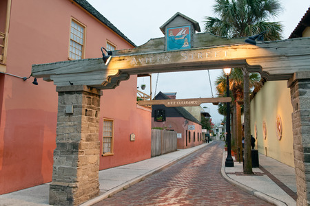 ST AUGUSTINE, APRIL 8, 2018: Entrance of tourist street with shops and restaurants. The city is a famous attraction in Florida.のeditorial素材