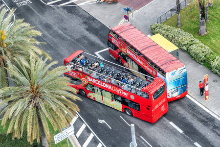 BARCELONA - MAY 13, 2018: Sightseeing buses along city roads. Barcelona attracts 10 million tourists annually.のeditorial素材