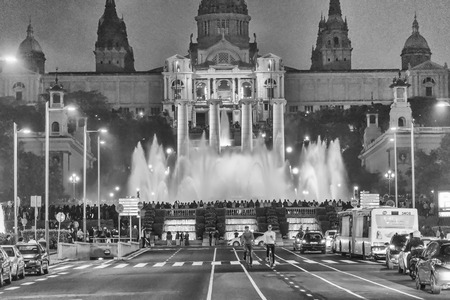 BARCELONA - MAY 12, 2018: Magic Fountain night show as seen from the street. The city attracts 10 million tourists annually.のeditorial素材