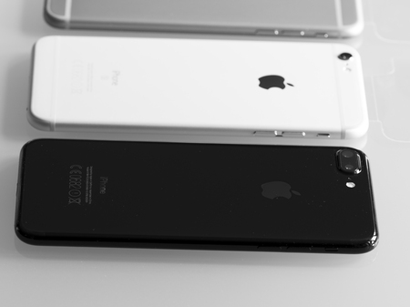 PISA, ITALY - OCTOBER 2016: New iPhone 7 plus jet black compared with older models. It was announced on September 7, 2016.のeditorial素材