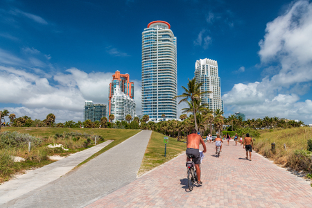 Cyclists and tourists in South Pointe Park on a sunny day, Miami, Florida, USA.のeditorial素材