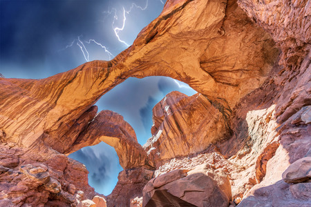 Double Arch during a storm in Arches National Park, Utah, USA.の写真素材