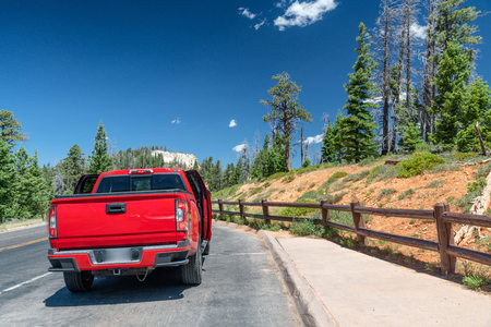 Red car discovering National Park, USA.の写真素材