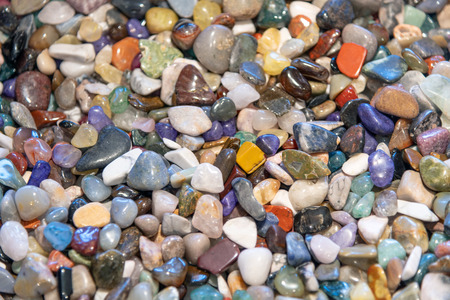 Colourful mineral stones collection in a creek.
