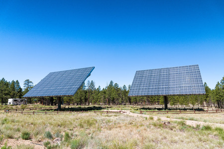 Giant solar panels in mountain scenario.