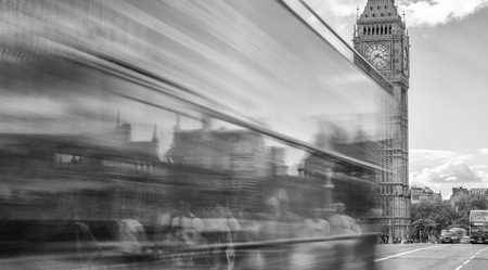 LONDON - SEPTEMBER 25, 2016: Bus crosses Westminster Bridge with tourists, blurred view. London attracts 30 million tourists annually.のeditorial素材