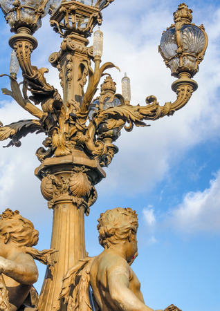 Statues of angels on the bridge of Paris in France "Pont Alexandre III".のeditorial素材