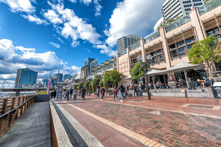 SYDNEY, AUSTRALIA - AUGUST 19, 2018: City skyscrapers in Darling Harbour on a beautiful sunny day. Sydney attracts 15 million tourists annually.のeditorial素材