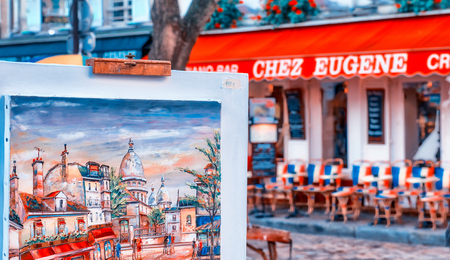 PARIS, FRANCE - DECEMBER 2012: Tourists visit Montmartre art district. The city attracts 40 million people every year.のeditorial素材