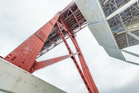 25th April Bridge in Lisbon on a cloudy day.の写真素材