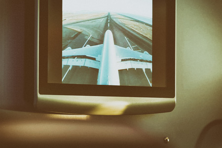 DOHA - AUGUST 2018: Airbus A380 wing and cockpit as seen from top camera in airplane screen. This is...