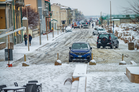 MARINA DI PISA, ITALY - MARCH 1, 2018: Road along the sea after a snowstorm. The town is a famous summer destination in Tuscany.のeditorial素材