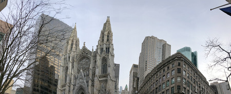 Midtown Manhattan, panoramic view of city buildings and church.