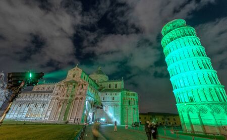 Green light illuminating Pisa Leaning Tower for St Patrick's day celebrations.の写真素材