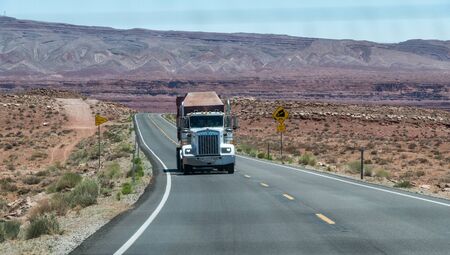 Big truck speeding up along Arizona road, united States.