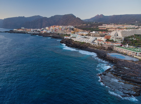 Aerial view of Puerto de Santiago coastline in Tenerife from drone.の写真素材