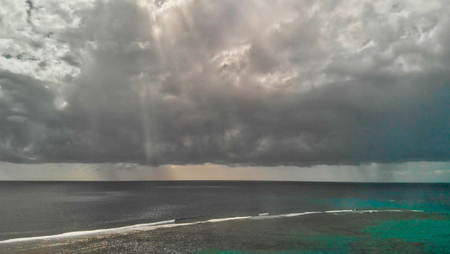 Aerial view of beauitful ocean with storm approaching.の写真素材