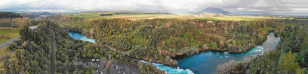 Huka Falls, New Zealand. Panoramic aerial view of beautiful waterfalls and countryside at sunset.の写真素材
