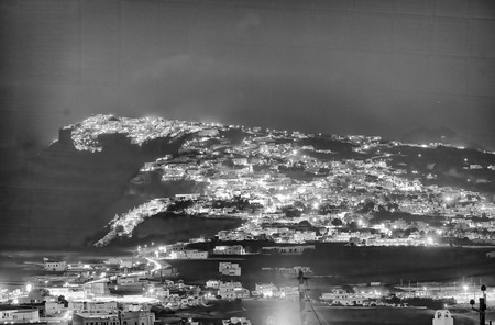 Aerial view of Santorini island coast at night.の写真素材