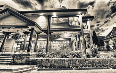 WHISTLER, CANADA - AUGUST 12, 2017: Tourists visit city center on a summer night. Whistler is a famous mountain destination in British Columbia.のeditorial素材