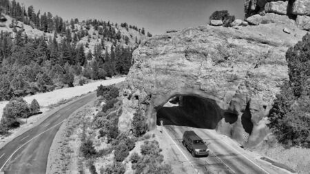 Tunnel entrance of Red Canyon and Bryce Canyon. Red arch located at the entrance of national park.