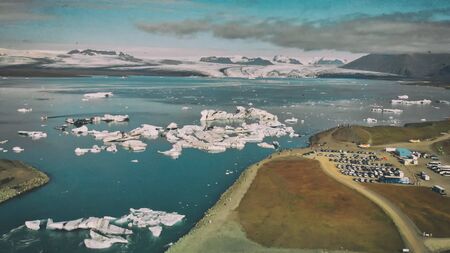 Aerial view of Jokullsarlon Glacier Lake and Icebergs at sunset, Iceland.