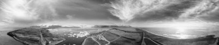 Aerial panoramic 360 degrees view of Jokullsarlon Glacier Lake and Icebergs at sunset, Iceland.の写真素材