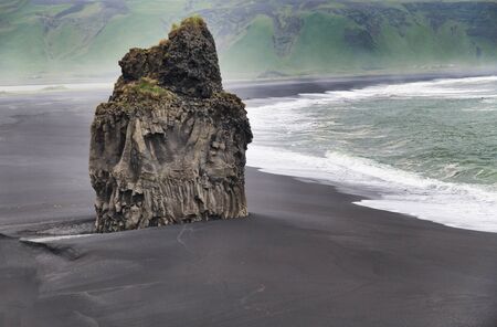Reynisfjara Black Beach on a cloudy summer morning, Iceland.