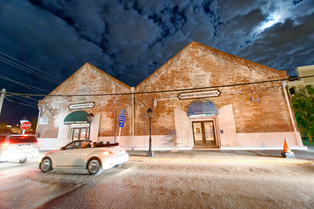 KEY WEST, FL - FEBRUARY 20, 2016: Key West street at night, blurred view of car traffic. Key West is the main city of Keys Islands.のeditorial素材