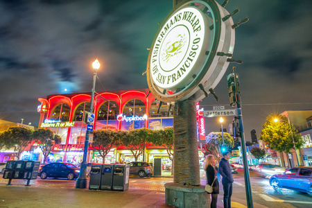 SAN FRANCISCO, CA - AUGUST 6, 2017: Night view of Fisherman's Wharf streets. The city attracts 20 million tourists annually.のeditorial素材