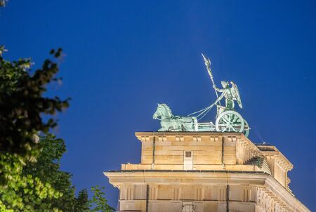 Brandenburg Gate at night in Berlin.の写真素材