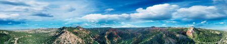Panoramic sunset aerial view of amazing Bryce Canyon Mountains and Rock Formations in summer.