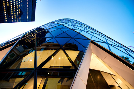 City of London at night, United Kingdom. Beautiful skyline as seen from the street, upward view.のeditorial素材