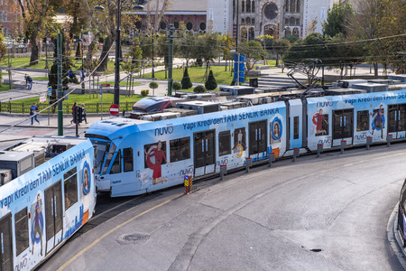 ISTANBUL, TURKEY - OCTOBER, 2014: City tram speeds up along city streets.