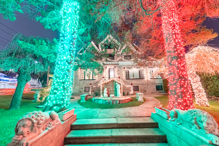 DYKER HEIGHTS, NY - DECEMBER 6, 2018: Christmas lights house decoration display in the suburban Brooklyn neighborhood of Dyker Heights in December.のeditorial素材