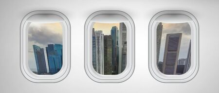 Airplane windows with Singapore skyline view. Travel and holiday abstract concept.の写真素材