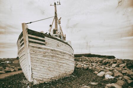 Keflavik, Iceland. Abandoned ship on the shoreline.