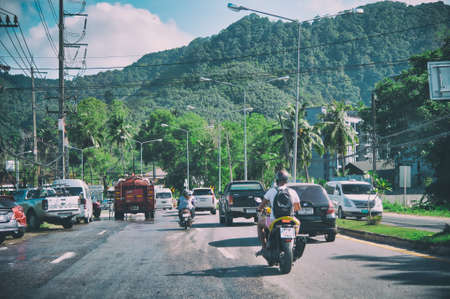 PHUKET, THAILAND - DECEMBER 19, 2019: Island roads with traffic on a sunny day. Phuket is a major destination for younger people.のeditorial素材