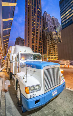 NEW YORK CITY - JUNE 2013: Giant truck at night parked along Manhattan streets.のeditorial素材