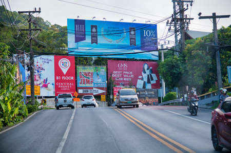 PHUKET, THAILAND - DECEMBER 19, 2019: Island roads with traffic on a sunny day. Phuket is a major destination for younger people.のeditorial素材